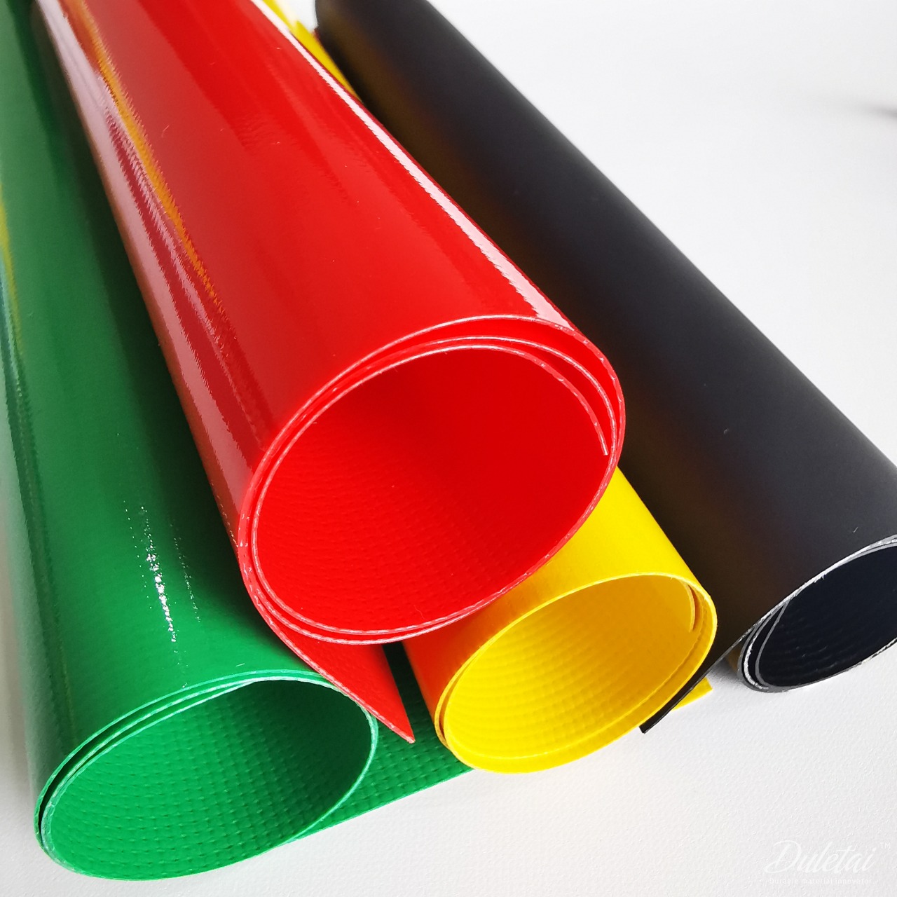 Duletai PVC bag fabric samples showing multiple colors and surfaces
